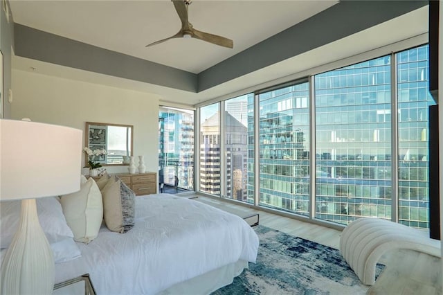 bedroom with hardwood / wood-style flooring and ceiling fan