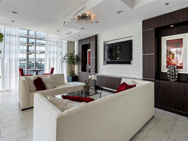 living room featuring floor to ceiling windows