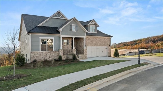 231 Laurel Vista Dr, Canton, GA 30114 - craftsman-style home featuring stone siding, concrete driveway, a standing seam roof, and metal roof