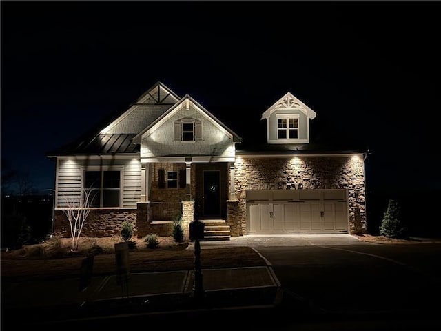 231 Laurel Vista Dr, Canton, GA 30114 - craftsman-style house featuring stone siding, driveway, a standing seam roof, a porch, and metal roof