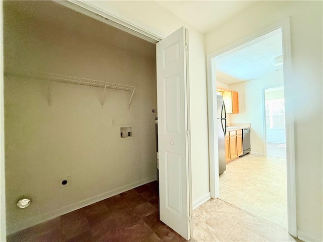 clothes washing area featuring hookup for a washing machine, laundry area, hookup for an electric dryer, and baseboards