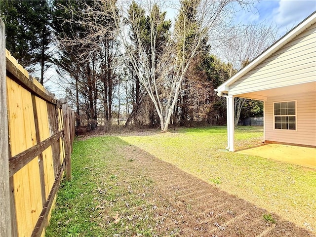 view of yard featuring a patio and fence