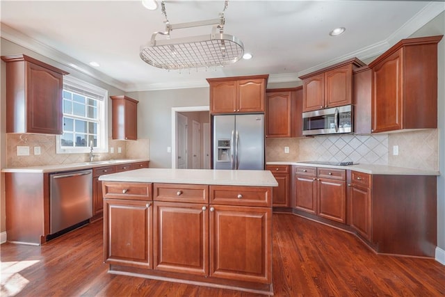 kitchen with crown molding, stainless steel appliances, dark hardwood / wood-style flooring, and a kitchen island