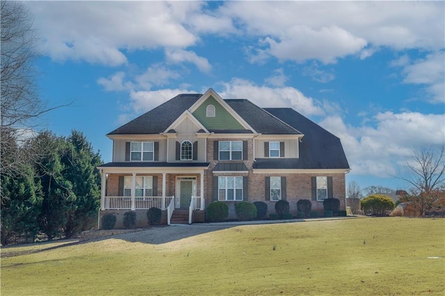 view of front of home featuring a porch and a front yard