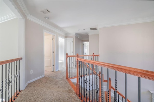 hallway with crown molding and light carpet