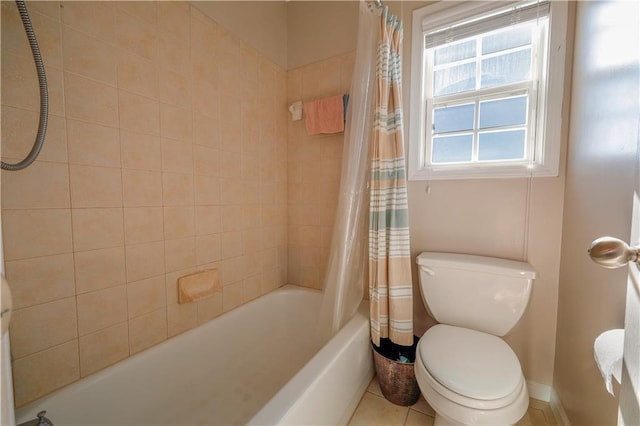 bathroom featuring shower / tub combo with curtain and toilet