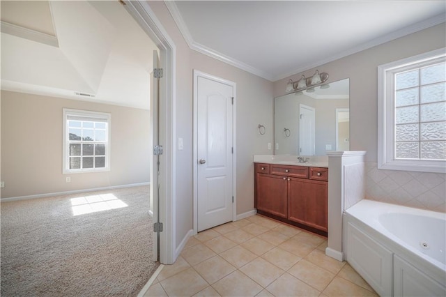 bathroom with vanity, a tub, tile patterned floors, and crown molding