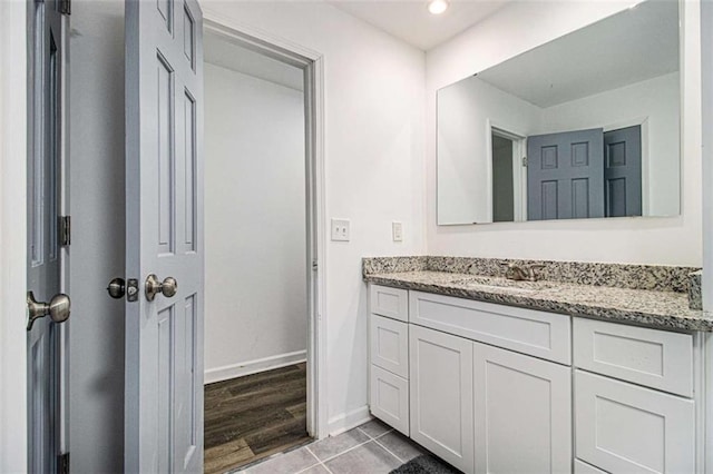 bathroom featuring tile patterned floors, recessed lighting, baseboards, and vanity