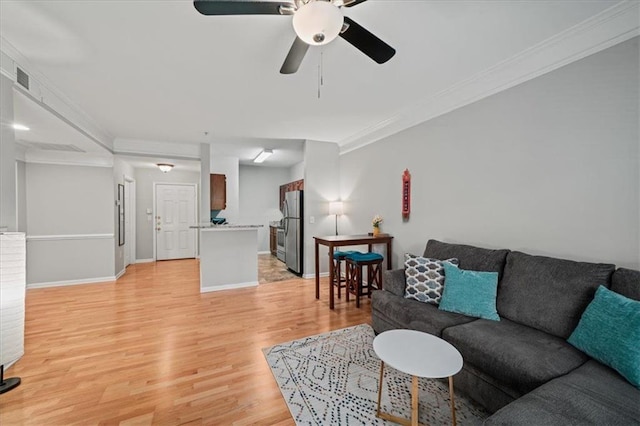 2700 Pine Tree Rd NE Unit 1214, Atlanta, GA 30324 - living area with a ceiling fan, crown molding, light wood-style floors, baseboards, and visible vents