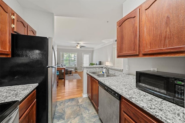 2700 Pine Tree Rd NE Unit 1214, Atlanta, GA 30324 - kitchen with stainless steel appliances, a sink, open floor plan, a ceiling fan, and crown molding