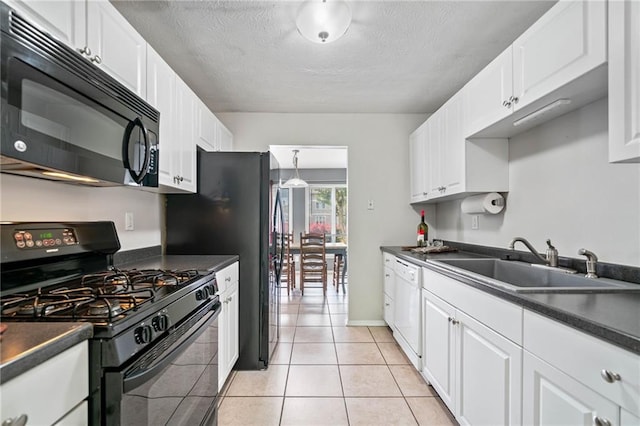 1810 Ashborough Rd SE Unit G, Marietta, GA 30067 - kitchen with black appliances, dark countertops, white cabinetry, and a textured ceiling