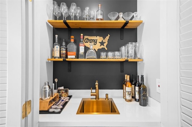 bar featuring a sink and a bar
