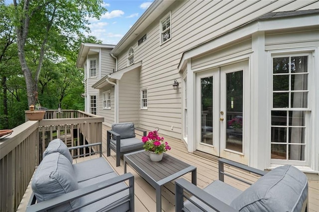 deck with french doors and an outdoor hangout area