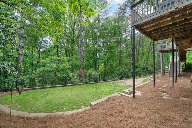 view of yard featuring stairway, fence, and a wooden deck