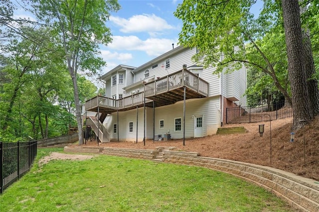 back of property with stairway, a deck, a yard, and a fenced backyard
