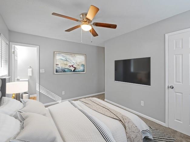 bedroom with ceiling fan and carpet