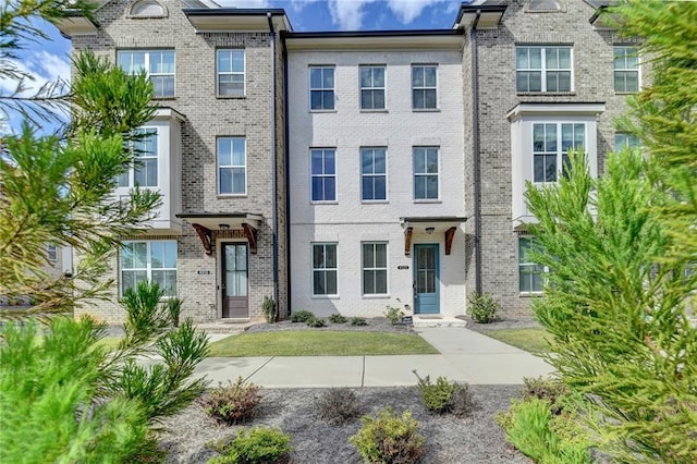 multi unit property featuring brick siding