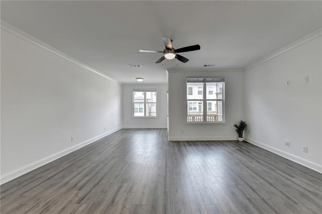 unfurnished living room featuring visible vents, crown molding, baseboards, ceiling fan, and dark wood-style flooring