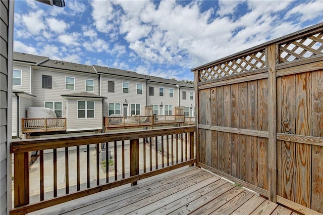 wooden terrace featuring a residential view