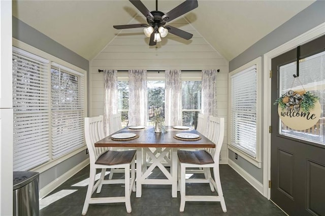 sunroom / solarium featuring lofted ceiling and ceiling fan