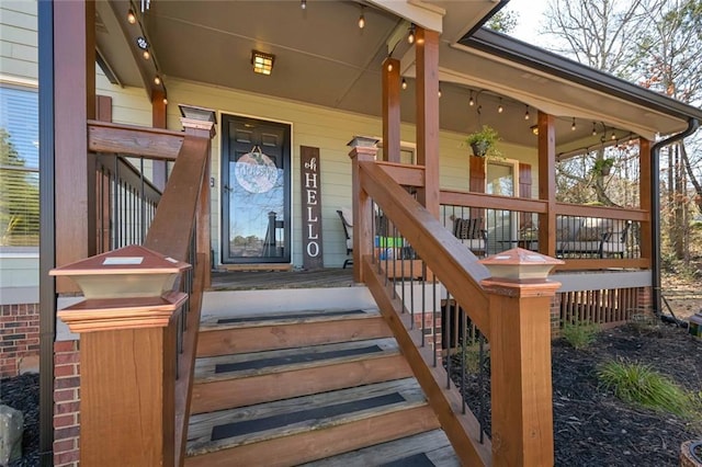 view of exterior entry featuring a porch