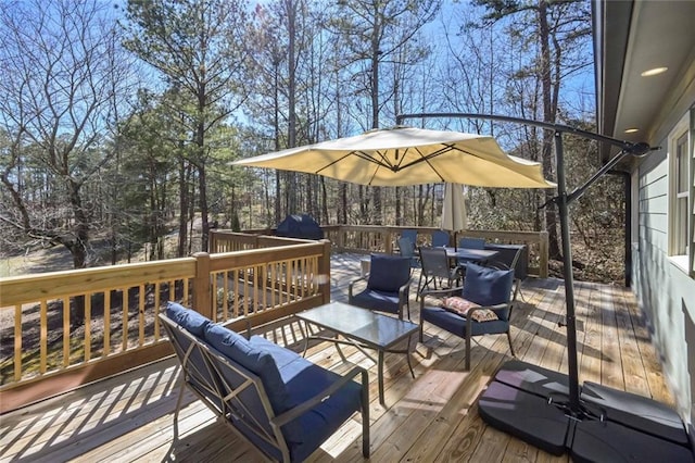 wooden terrace featuring an outdoor hangout area