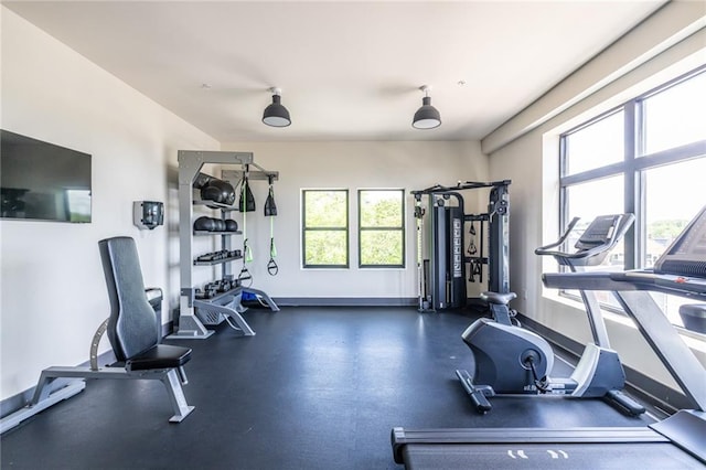 gym featuring baseboards