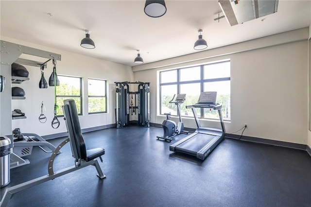 exercise room with baseboards