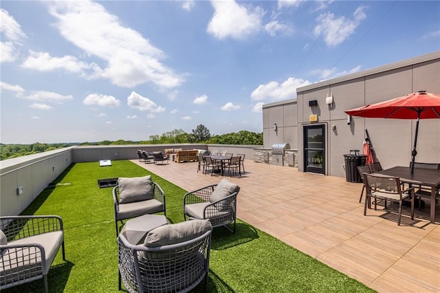 view of patio / terrace with grilling area, outdoor dining area, an outdoor living space, and area for grilling