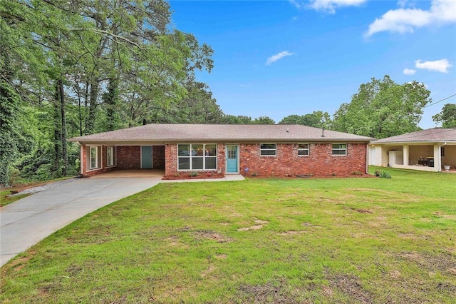 191 Pine St NE, Fairburn, GA 30213 - ranch-style house with concrete driveway, brick siding, and a front lawn