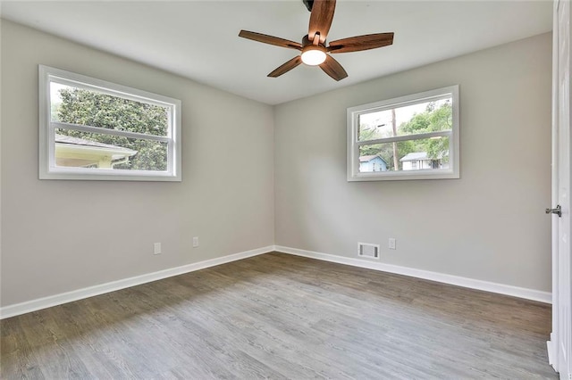 191 Pine St NE, Fairburn, GA 30213 - unfurnished room featuring plenty of natural light, baseboards, and wood finished floors