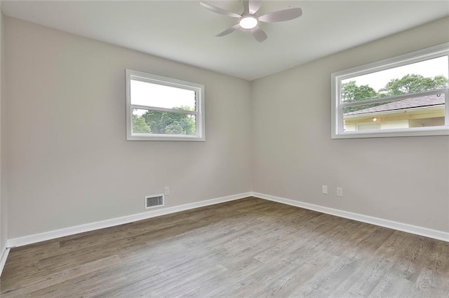 191 Pine St NE, Fairburn, GA 30213 - unfurnished room with plenty of natural light, wood finished floors, baseboards, and ceiling fan
