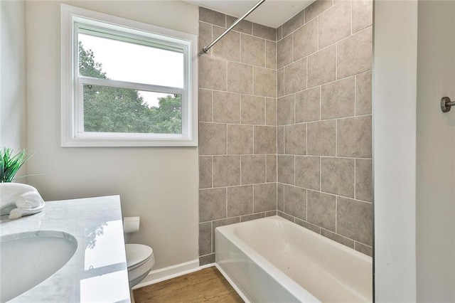 191 Pine St NE, Fairburn, GA 30213 - full bathroom with toilet, baseboards, vanity,  shower combination, and wood finished floors