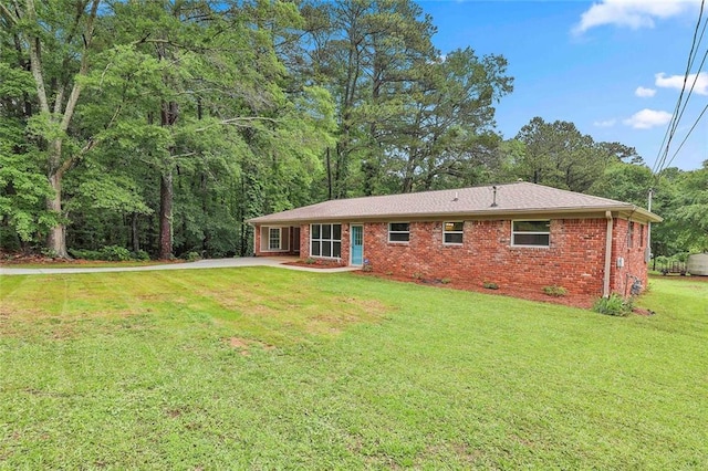 191 Pine St NE, Fairburn, GA 30213 - back of house with brick siding and a yard