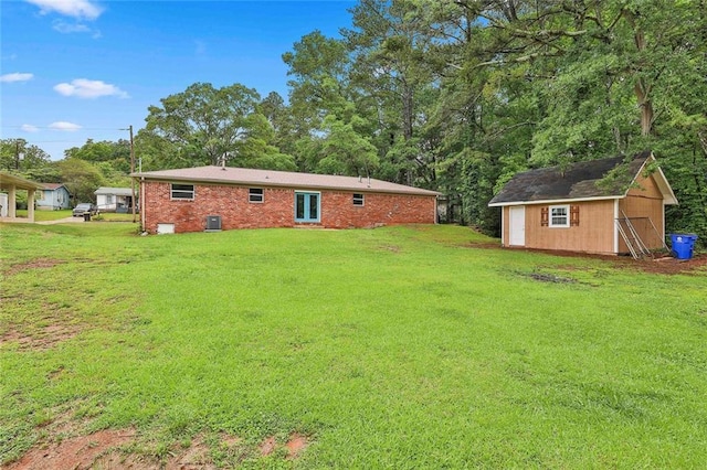191 Pine St NE, Fairburn, GA 30213 - rear view of property featuring a lawn and brick siding