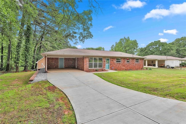 191 Pine St NE, Fairburn, GA 30213 - single story home with driveway, a front yard, brick siding, and a carport