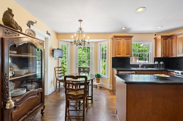 kitchen featuring dark countertops, a chandelier, dark wood finished floors, baseboards, and recessed lighting