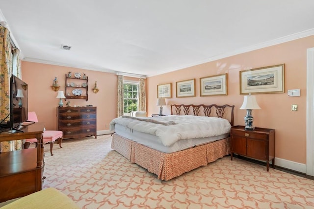 bedroom featuring ornamental molding and baseboards