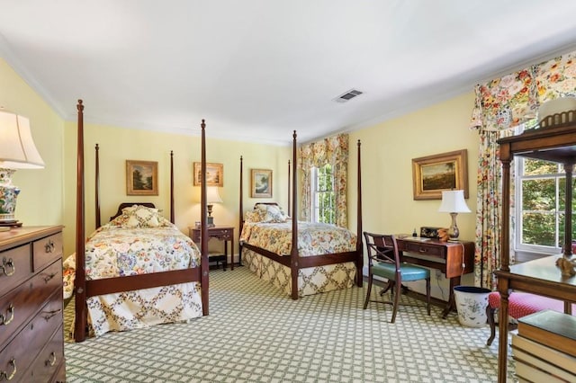 bedroom featuring crown molding and light carpet