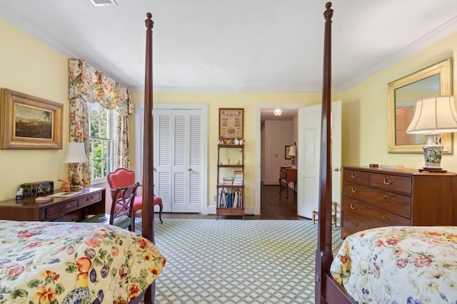 bedroom featuring carpet, ornamental molding, and a closet