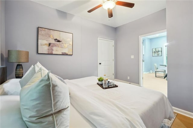 bedroom featuring ceiling fan and light wood-type flooring