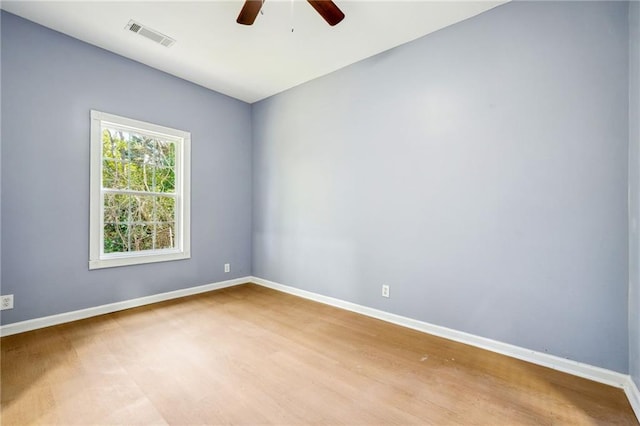 empty room featuring ceiling fan and light hardwood / wood-style floors