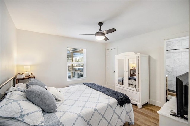 bedroom featuring ceiling fan and light wood finished floors