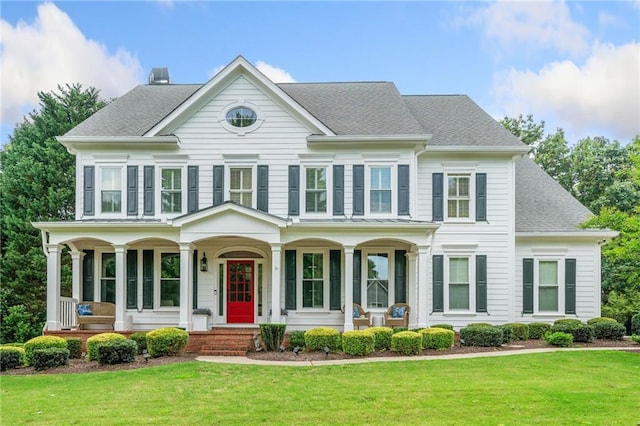 6219 Creekstone Path, Cumming, GA 30041 - view of front facade with a porch, a front lawn, a shingled roof, and a chimney