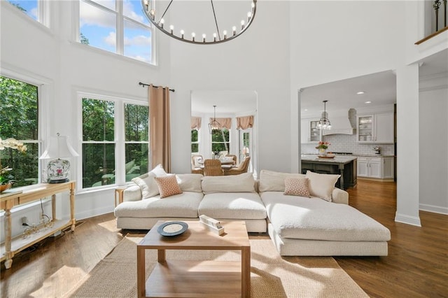 6219 Creekstone Path, Cumming, GA 30041 - living room with a chandelier, a high ceiling, and plenty of natural light
