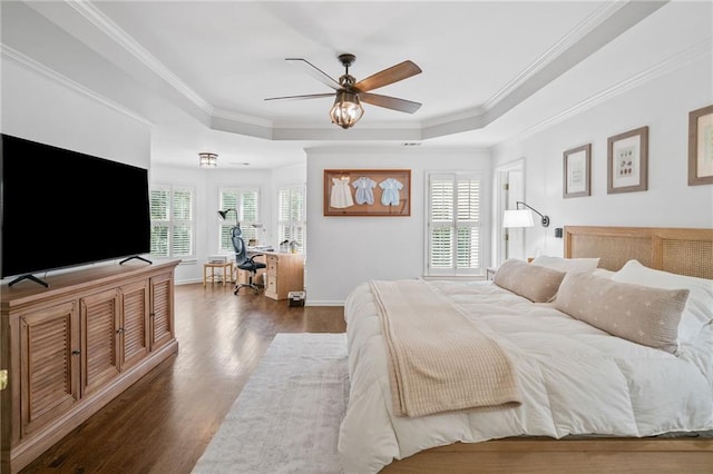 6219 Creekstone Path, Cumming, GA 30041 - bedroom with a tray ceiling, dark wood-style floors, a desk, ornamental molding, and baseboards