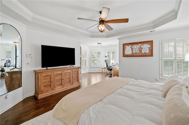 6219 Creekstone Path, Cumming, GA 30041 - bedroom with a raised ceiling, dark wood-style flooring, crown molding, a ceiling fan, and baseboards