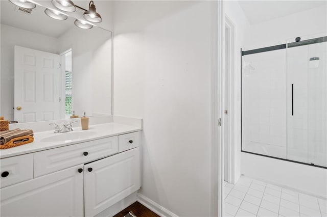 6219 Creekstone Path, Cumming, GA 30041 - full bath with vanity, bath / shower combo with glass door, baseboards, and tile patterned flooring