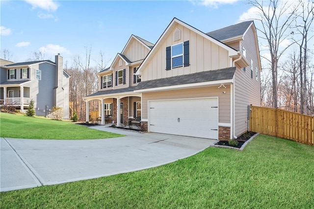 craftsman house with driveway, fence, board and batten siding, a front yard, and a garage