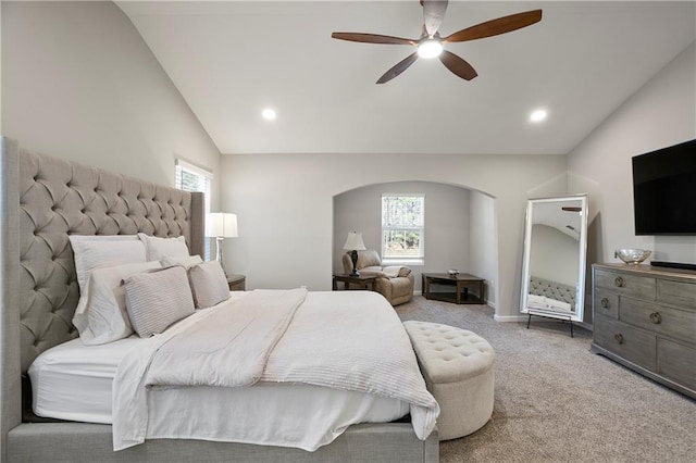 carpeted bedroom featuring recessed lighting, arched walkways, a ceiling fan, and vaulted ceiling